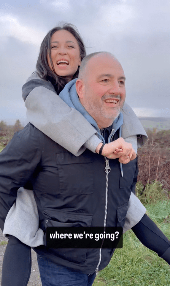 a man is carrying a woman on his back with the caption where we 're going