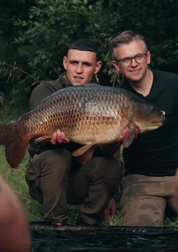 Phil Foden was thrilled with his huge carp, pictured with ITV4’s Monster Carp host Neil Spooner