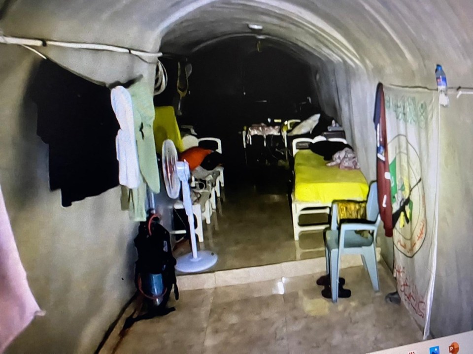 A Hamas flag hanging on the wall inside his secret lair