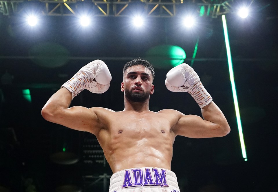 Adam Azim celebrates a boxing victory.