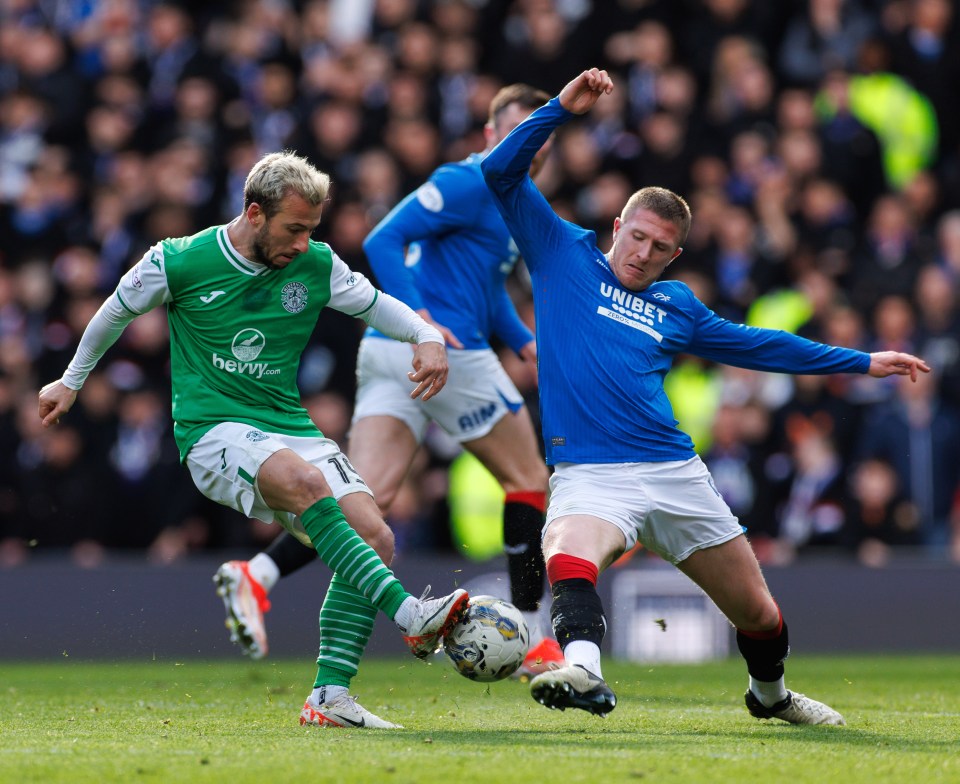 a soccer player in a blue jersey with the word unibet on it