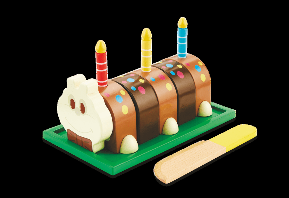 a birthday cake shaped like a caterpillar with candles on it