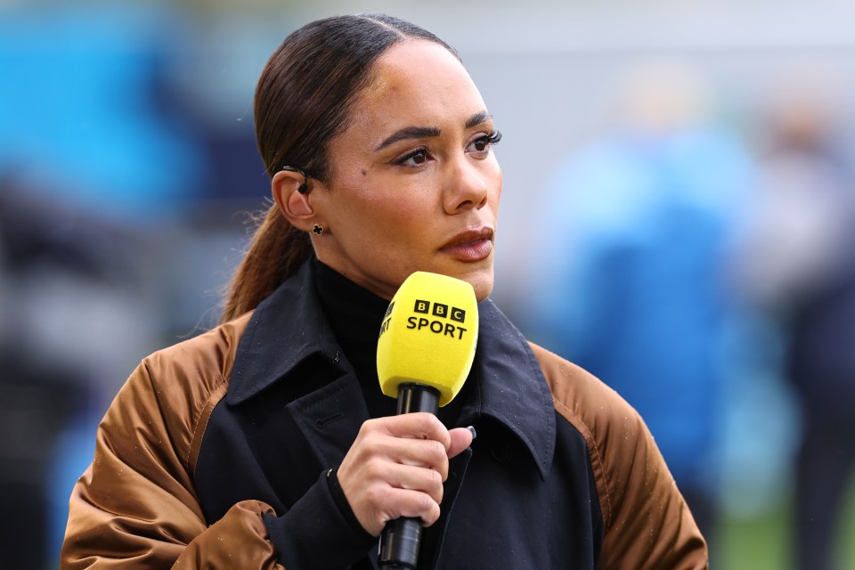 a woman holding a yellow microphone that says bbc sport