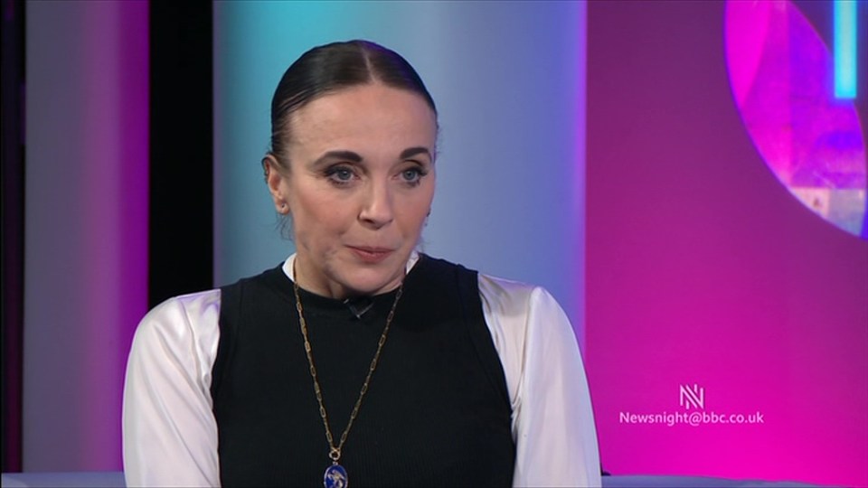 a woman with a necklace is on a newsnight show