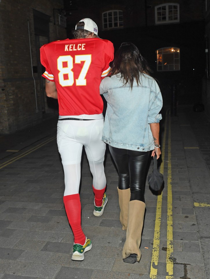 Andy was dressed as Travis Kelce but it was unclear who Lou was emulating