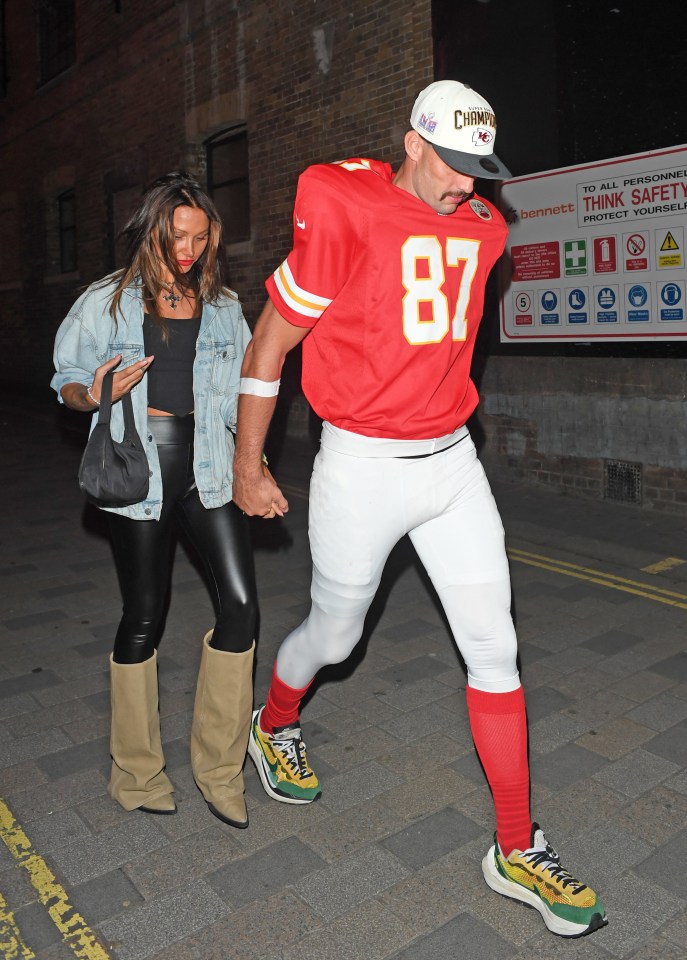 a man in a red jersey with the number 87 on it