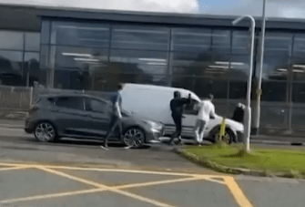 The group then headed over to the van where one appeared to start smashing the window in