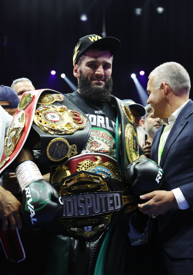 a boxer with a belt that says disputed on it