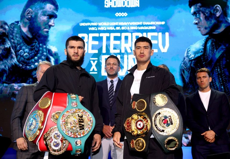 two boxers standing in front of a sign that says showdown