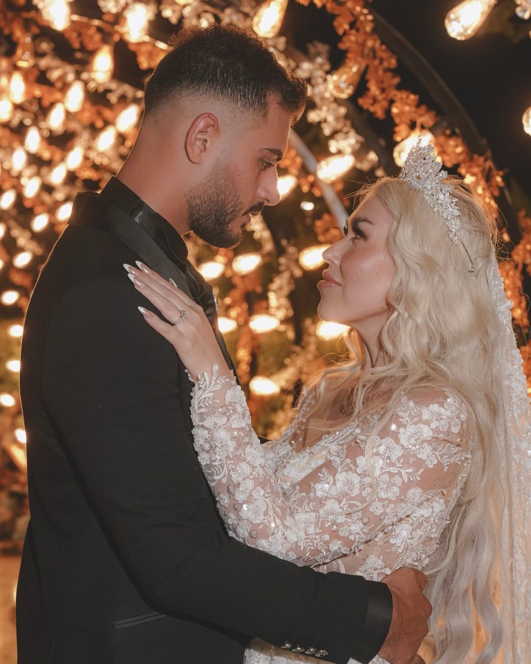 a bride and groom are looking into each other 's eyes