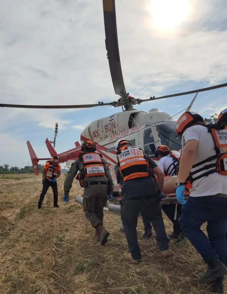 A United Hatzalah team rushing an injured civilian to an air ambulance