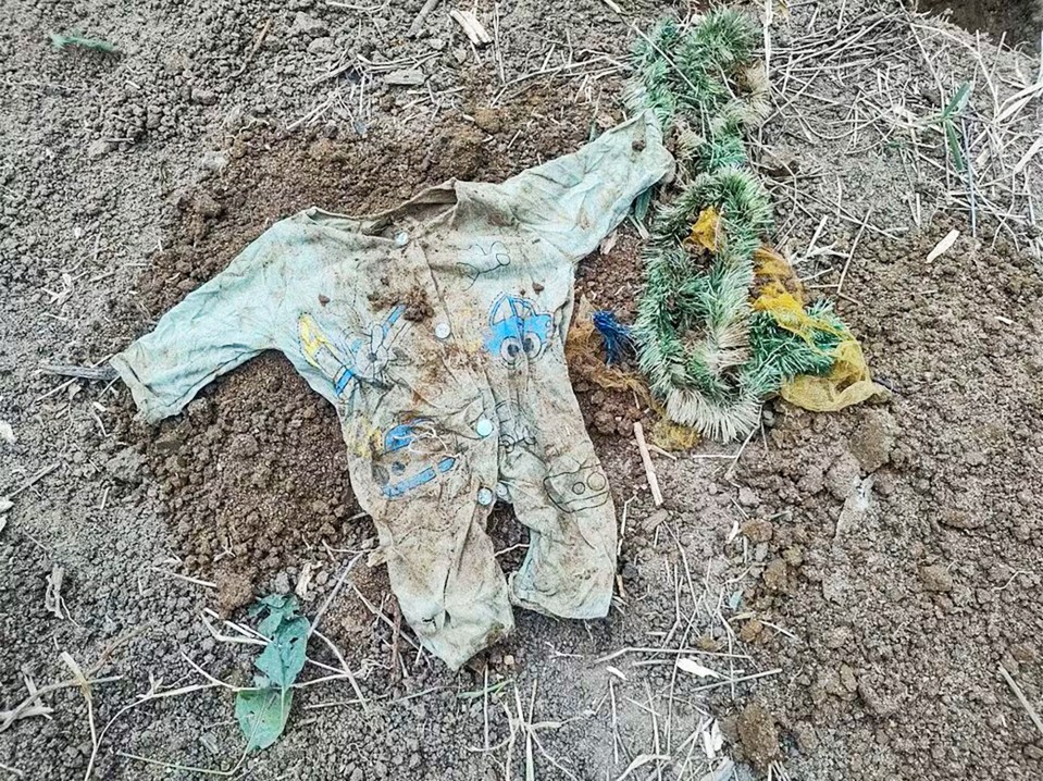 Baby clothes found in the yard where the fetuses were buried