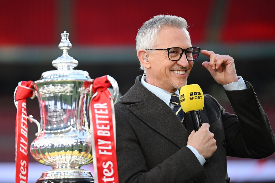 a man holding a microphone that says bbc sport