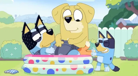 three cartoon dogs are playing in an inflatable pool .