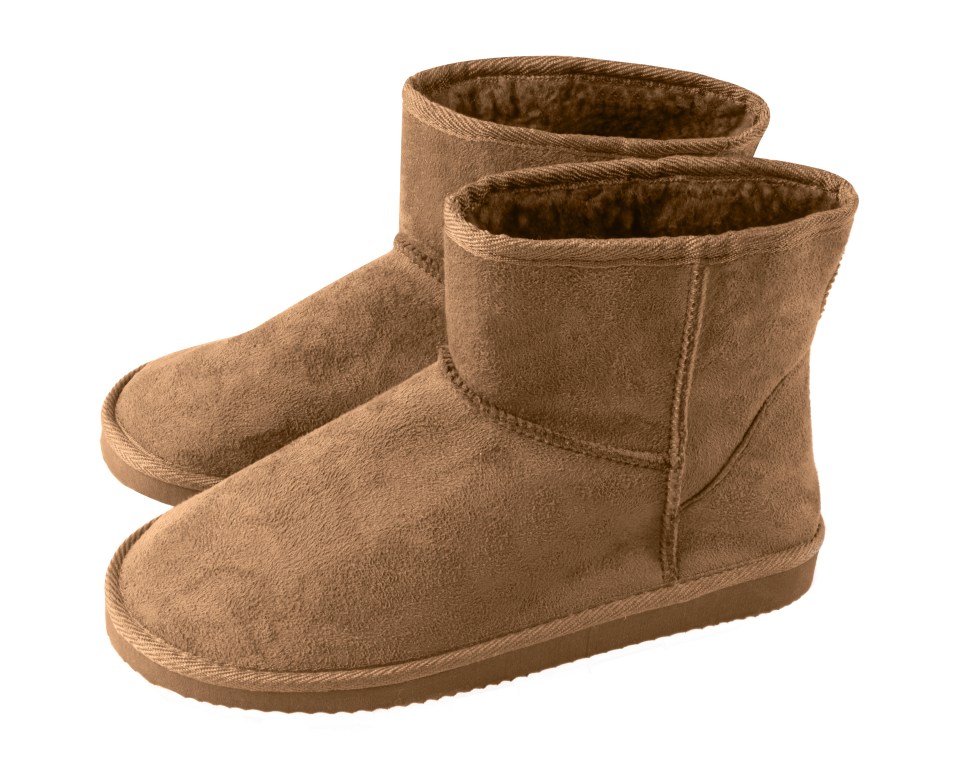 a pair of brown boots on a white background