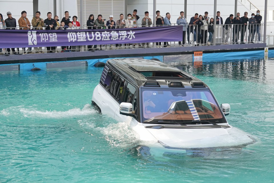 The BYD YangWang U8 demonstrates its floating abilities in a pool in China