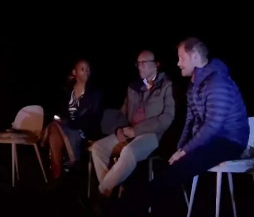 a group of people are sitting in a dark room and the caption says " inspiring and passionate conversations around the lionfire "