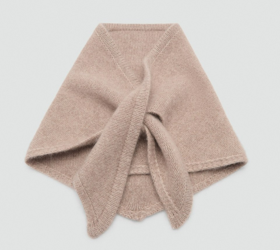 a beige scarf with a knot in the middle