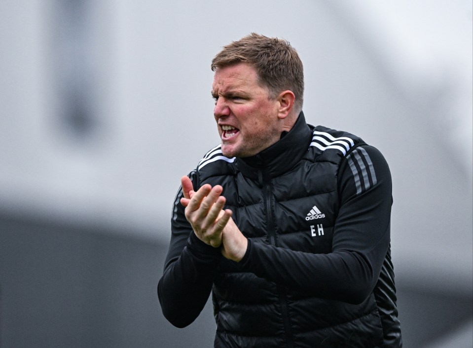 a man wearing a black adidas vest clapping his hands