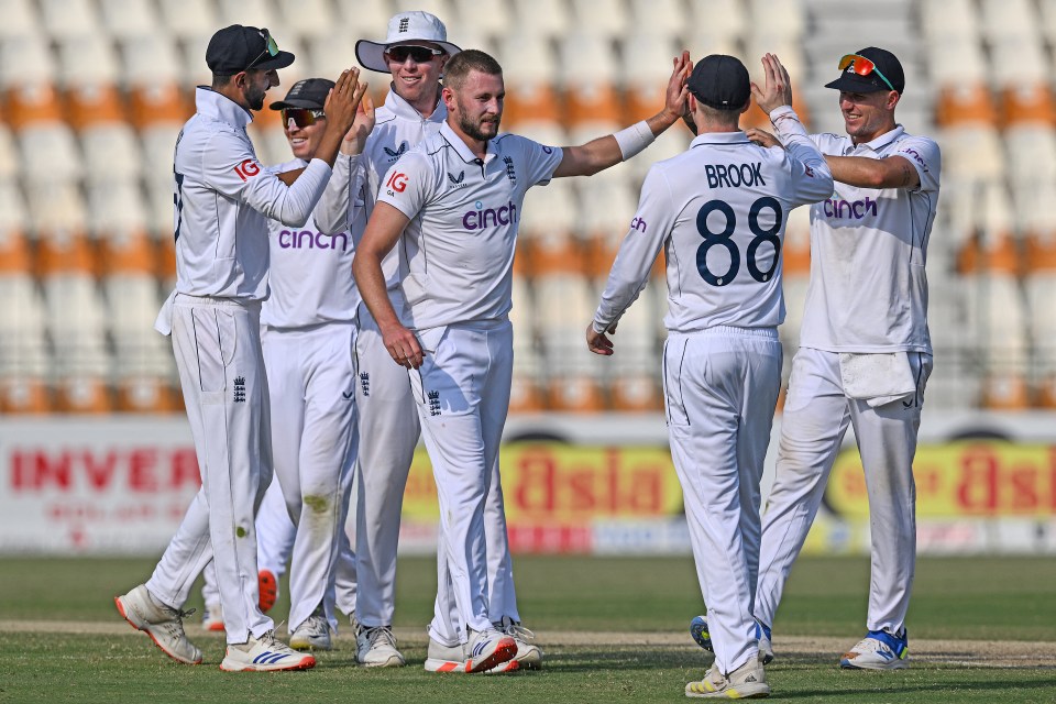 a group of cricket players with one wearing the number 88