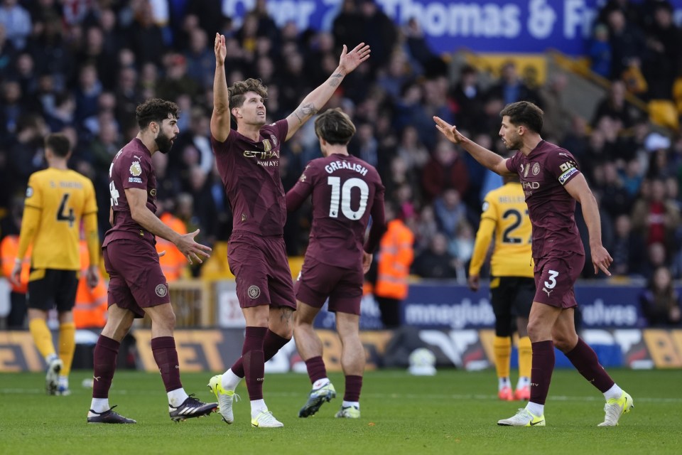 a group of soccer players with one wearing the number 10