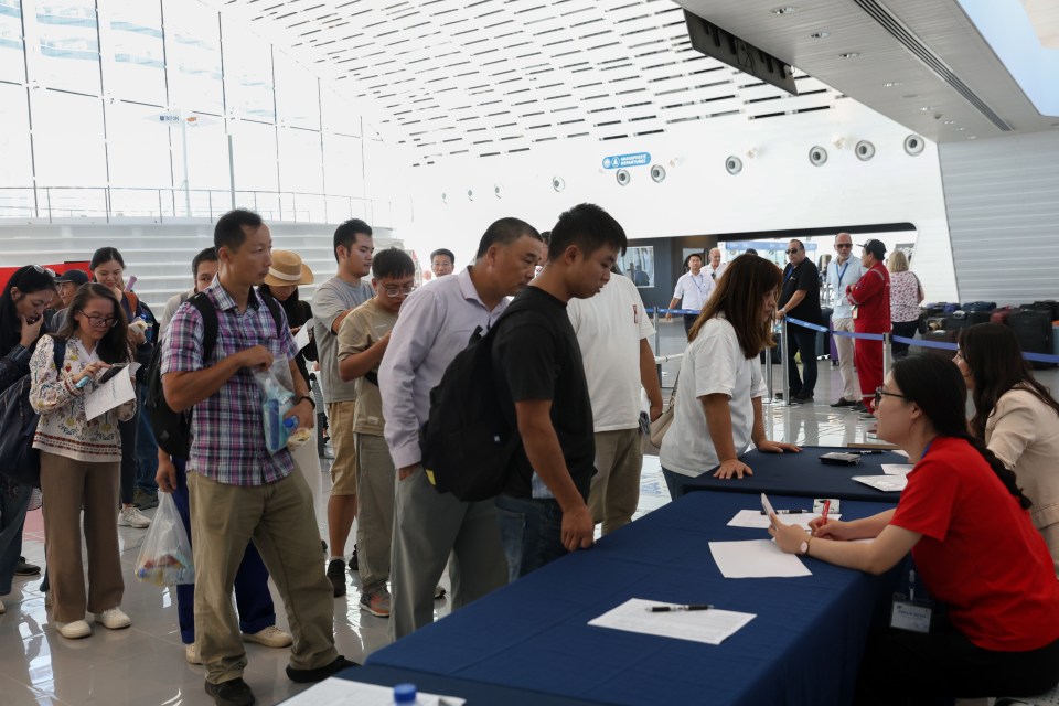 Chinese citizens and their foreign family members from Lebanon line up for procedures at the Port of Limassol, Cyprus