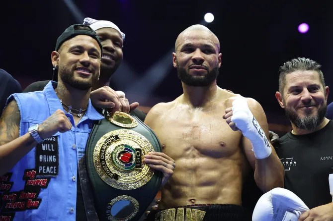 a boxer with a belt that says world champion on it