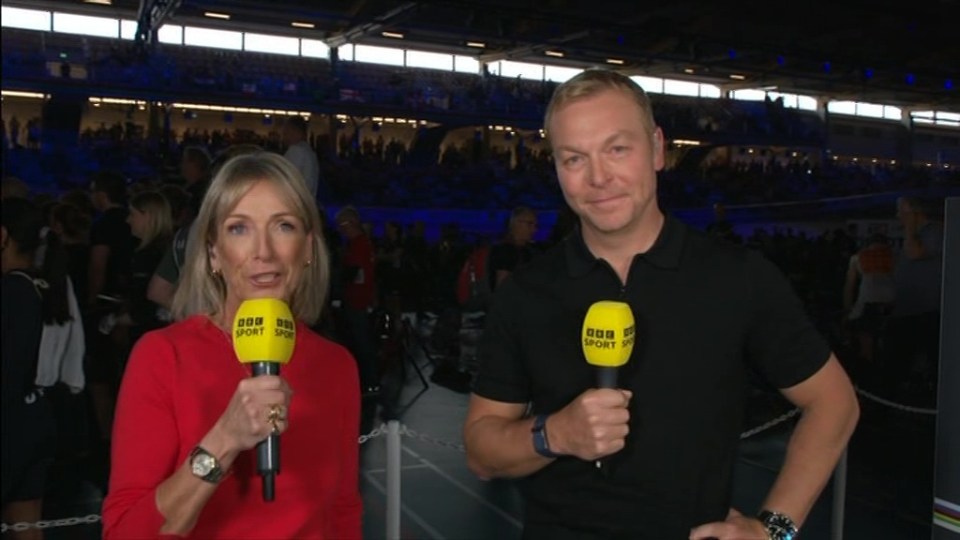 jill douglas is standing next to a man holding a microphone