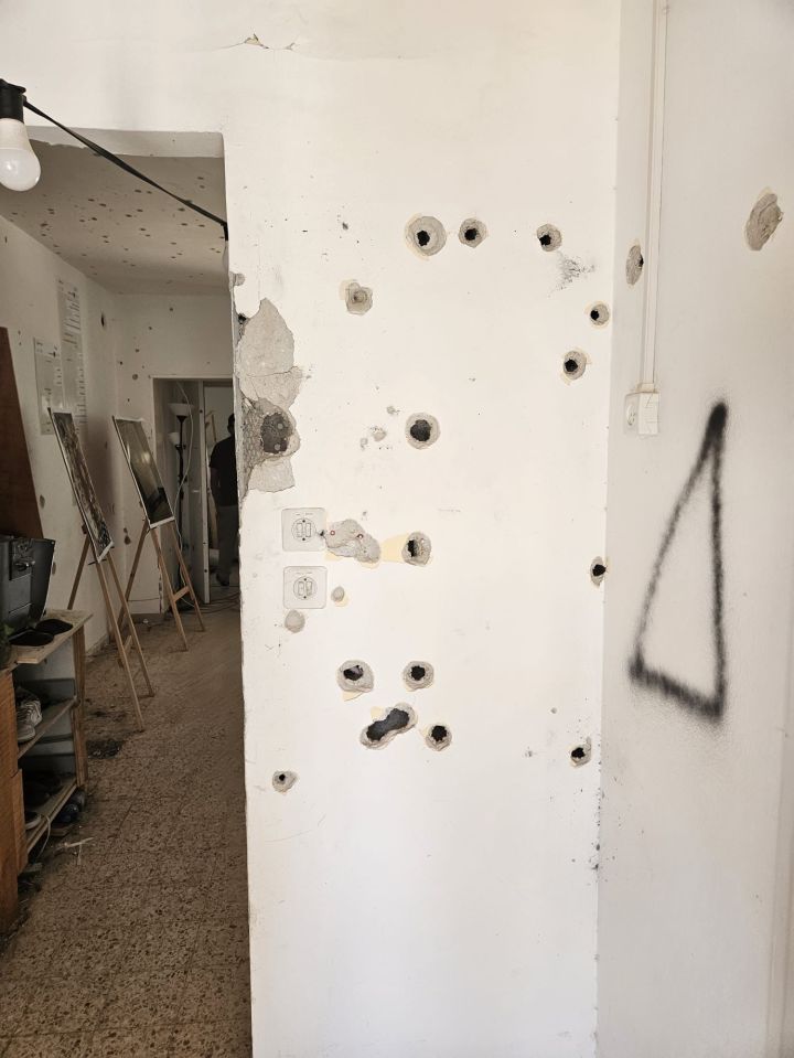 Bullet holes in the wall of a kibbutz