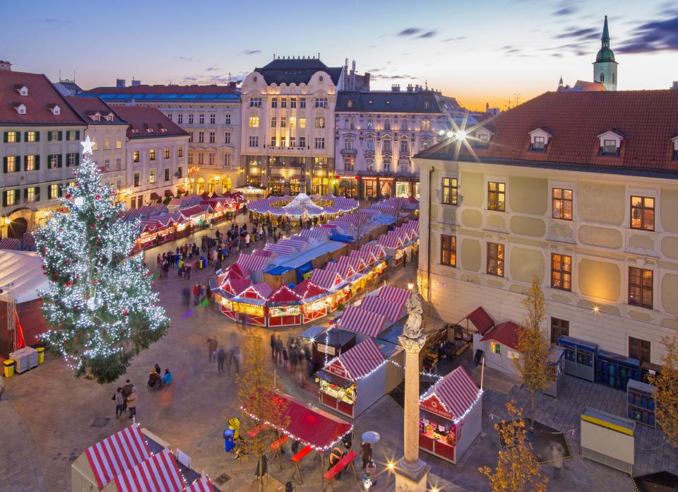 an aerial view of a christmas market in a city