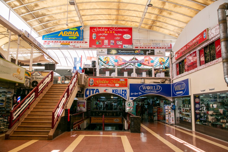 a store called golden moments is in the middle of a shopping mall