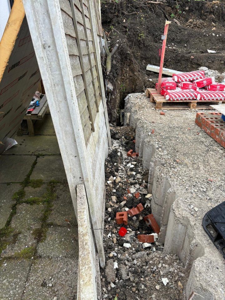 Rachel Laidler, 55, has put up a banner saying she is ‘not loving’ a new MacDonald’s – after claiming its builders ‘destroyed’ her fence