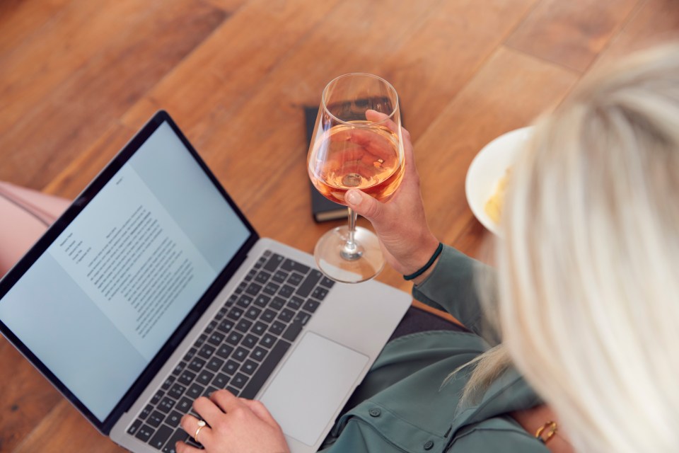 The communications expert thinks nothing of cracking open a bottle of wine while working (stock image)