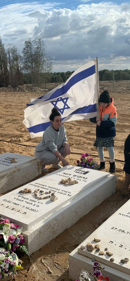 Emily Hand at her mother's grave with her sister Natalie