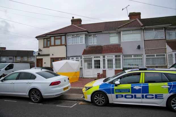 a police car is parked in front of a house