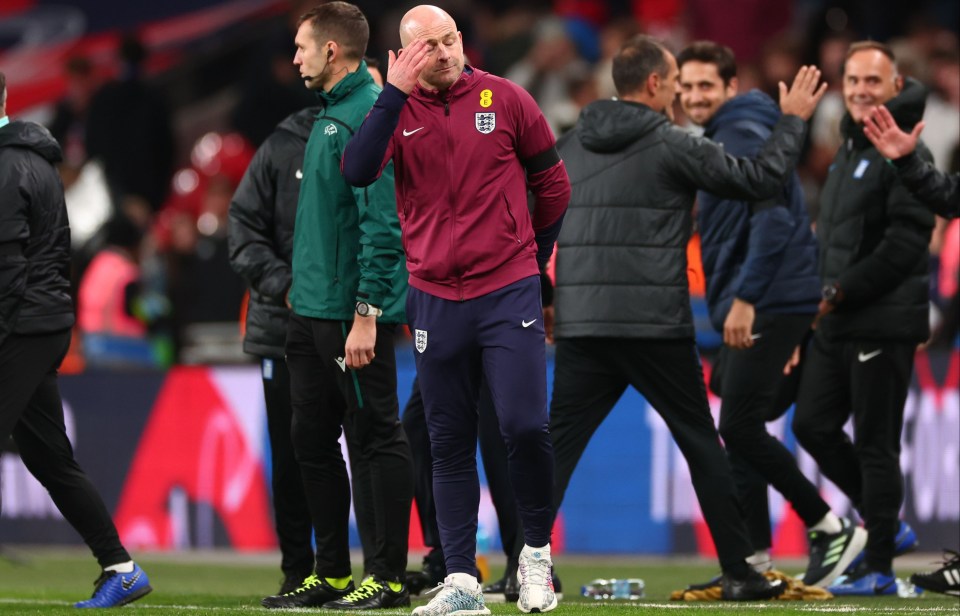 a man wearing a nike jacket with england on it