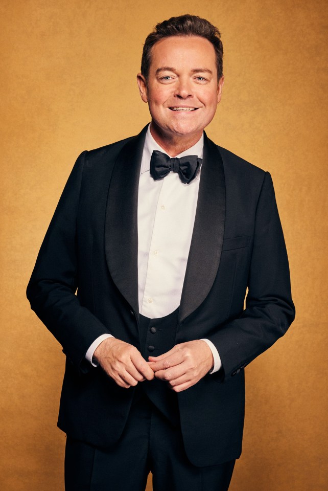 a man in a tuxedo and bow tie is smiling