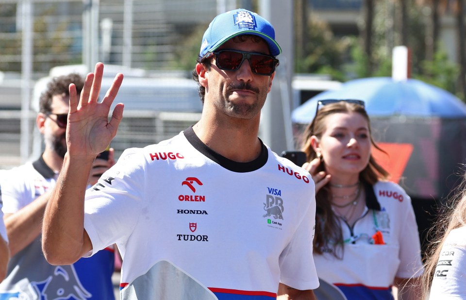 a man wearing a shirt that says tudor on it