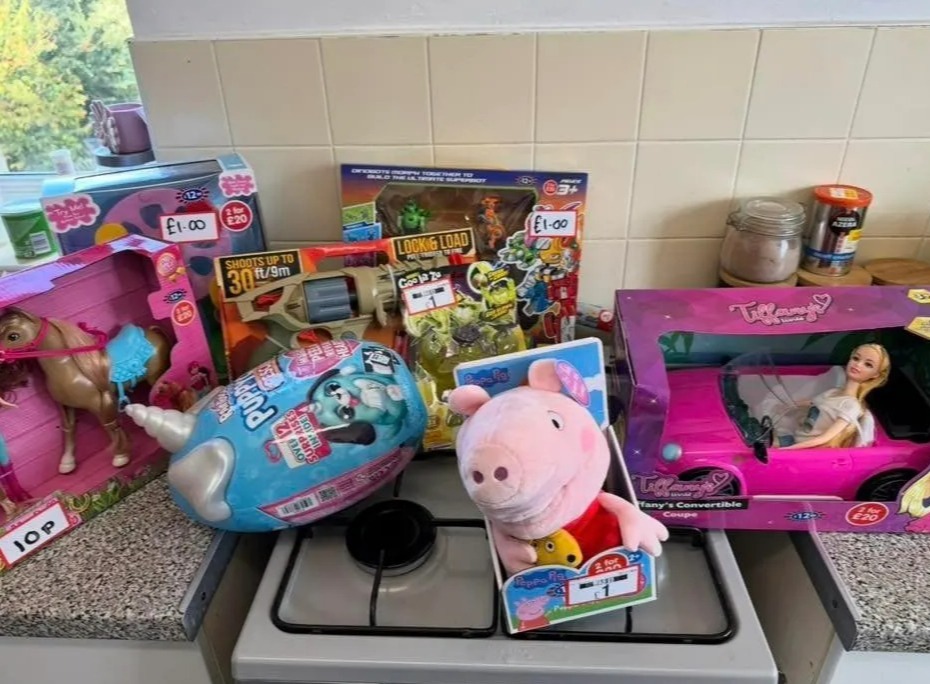 a bunch of toys on a counter including a peppa pig