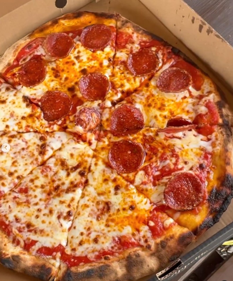 a computer screen shows a picture of a pepperoni pizza on instagram