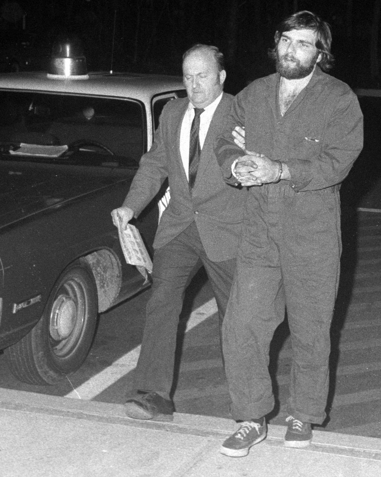 Ronald DeFeo Jr being led away by cops after killing his family