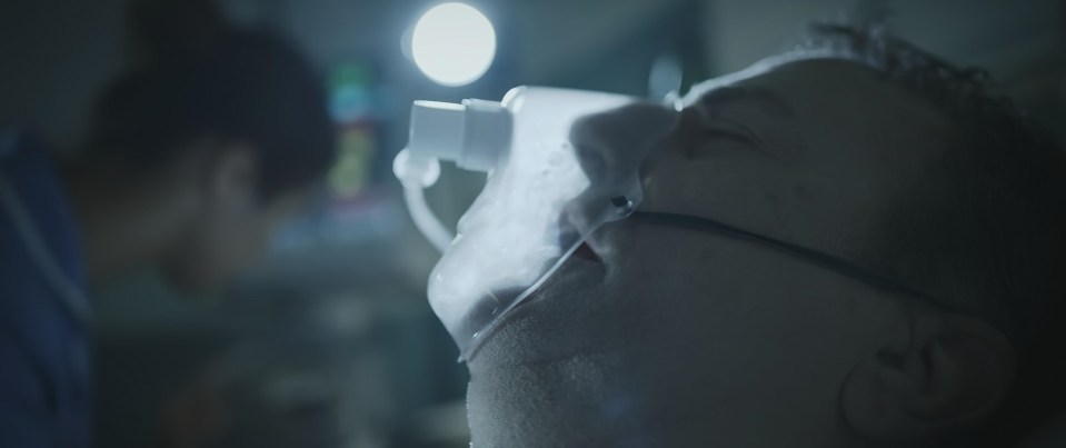 a man with an oxygen mask on his face