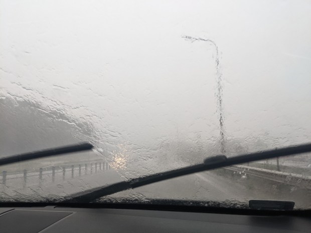 a car windshield with a lot of water on it