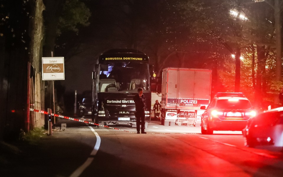 Cops at the team bus after the bomb attack