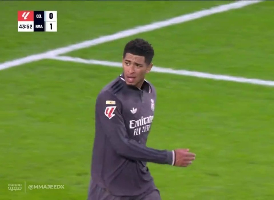 a soccer player wearing an emirates fly emirates jersey