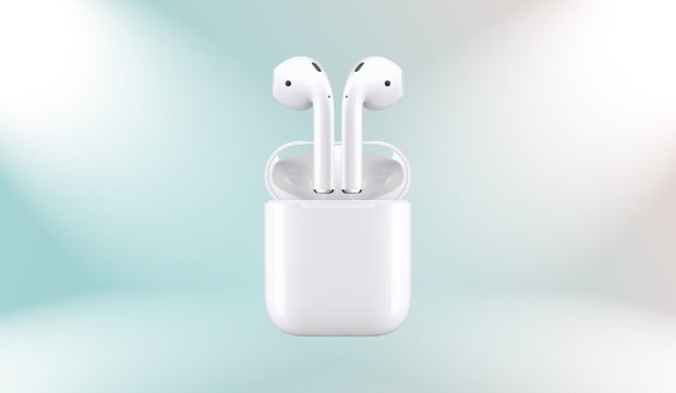 a pair of white earbuds in a charging case