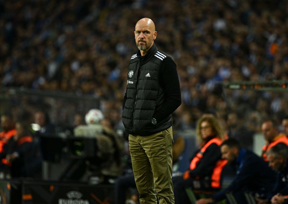 a man wearing an adidas vest stands in front of a crowd