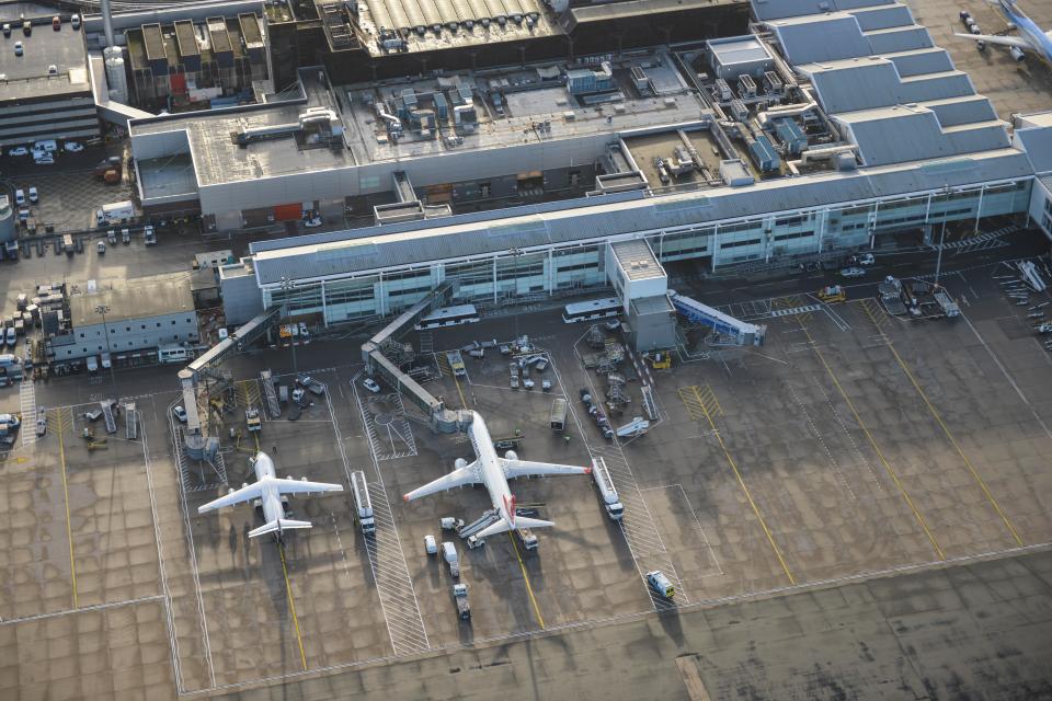 an aerial view of an airport with planes on the tarmac