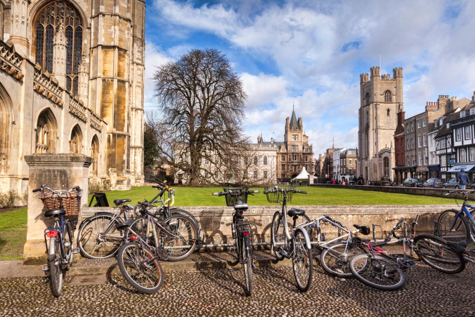 a row of bicycles are parked in front of a church