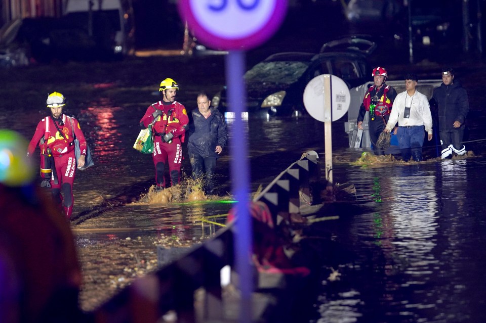 Emergency crew rescuing residents after they were trapped in their homes in Valencia